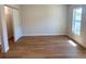 Spacious bedroom boasts wood-look floors, a large window, and an oversized walk-in closet at 1426 19Th St, Sarasota, FL 34234