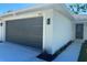 The home's exterior shows a spacious garage and an immaculate walkway at 1426 19Th St, Sarasota, FL 34234