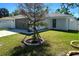 Charming single-story home with a well-manicured lawn and attached garage at 1426 19Th St, Sarasota, FL 34234