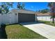 Attached two-car garage and freshly poured driveway complement the home at 1426 19Th St, Sarasota, FL 34234