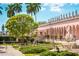 Beautifully landscaped grounds with sculptures, manicured plants, and stunning architecture create an inviting atmosphere at 1426 19Th St, Sarasota, FL 34234