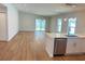 Open concept kitchen featuring stainless steel appliances, white cabinets, and outdoor views at 1426 19Th St, Sarasota, FL 34234