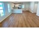 Bright living room with wood-look floors, connecting to the kitchen with quartz countertops at 1426 19Th St, Sarasota, FL 34234