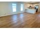 Open living area with modern kitchen featuring quartz counters and stainless steel appliances at 1426 19Th St, Sarasota, FL 34234