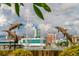 A waterfront view features a fountain adorned with dolphin statues at 1426 19Th St, Sarasota, FL 34234