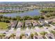 A stunning aerial view of the houses backing up to a lake in a beautiful landscaped community at 18013 Polo Trl, Bradenton, FL 34211