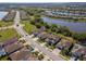 An aerial view of a residential community featuring stunning lake views and manicured lawns at 18013 Polo Trl, Bradenton, FL 34211