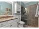 Updated bathroom featuring granite countertops and glass shower door at 18013 Polo Trl, Bradenton, FL 34211