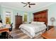 Bright bedroom with hardwood floors, natural light, and stylish furnishings at 18013 Polo Trl, Bradenton, FL 34211