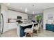 Bright kitchen with granite countertops, modern appliances, and a large island with seating at 18013 Polo Trl, Bradenton, FL 34211