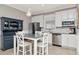 Eat in kitchen with stainless appliances, granite countertops, and stylish blue hutch at 18013 Polo Trl, Bradenton, FL 34211