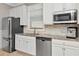Bright kitchen with stainless steel appliances and granite countertops and tiled backsplash at 18013 Polo Trl, Bradenton, FL 34211