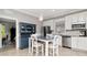 Eat in kitchen with stainless appliances, granite countertops, and stylish blue hutch at 18013 Polo Trl, Bradenton, FL 34211