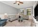 Cozy living room with neutral tones, comfortable seating, and large windows at 18013 Polo Trl, Bradenton, FL 34211