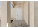 Welcoming front entrance with a modern light fixture and tiled flooring at 2364 Carpenter Ln, North Port, FL 34286