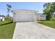 Charming home featuring a spacious two-car garage and a beautifully paved driveway at 2364 Carpenter Ln, North Port, FL 34286