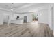 Bright open floorplan features modern lighting, stainless appliances, and a sliding glass door to the yard at 2364 Carpenter Ln, North Port, FL 34286