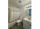 Bathroom with shower-tub combination, white toilet, and vanity offering a cozy atmosphere at 2632 Hidden Lake N Dr # E, Sarasota, FL 34237