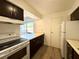 Charming kitchen with stainless appliances and view to patio, perfect for cooking and relaxing at 2632 Hidden Lake N Dr # E, Sarasota, FL 34237