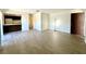 Spacious living room features modern flooring and access to kitchen at 2632 Hidden Lake N Dr # E, Sarasota, FL 34237