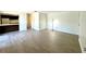 Inviting living room with contemporary flooring and a glimpse of the kitchen at 2632 Hidden Lake N Dr # E, Sarasota, FL 34237