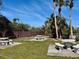 Community picnic area with stone tables and ample seating under shady palms at 2632 Hidden Lake N Dr # E, Sarasota, FL 34237