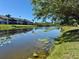 Scenic view of the waterway, showcasing the community's beautiful surroundings at 2632 Hidden Lake N Dr # E, Sarasota, FL 34237