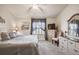 Cozy bedroom features a comfortable bed, soft lighting, and a neutral color palette, creating a relaxing retreat at 2908 Fiddlers Bnd, Palmetto, FL 34221