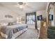 Cozy bedroom featuring a comfortable bed, carpet and a TV on dresser at 2908 Fiddlers Bnd, Palmetto, FL 34221