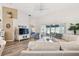 Bright living room boasts hardwood floors, contemporary furniture, and sliding glass doors to the patio at 2908 Fiddlers Bnd, Palmetto, FL 34221