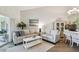 Inviting living area with neutral tones, wood floors, stylish seating, and lots of natural light at 2908 Fiddlers Bnd, Palmetto, FL 34221