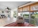 Spacious living room area featuring large windows and backyard views and comfortable seating at 3289 Fairhaven Ln # 112, Sarasota, FL 34239