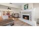 Bright and airy living room with a fireplace, comfortable seating, and access to dining area at 3289 Fairhaven Ln # 112, Sarasota, FL 34239