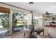 Bright and airy living room with ceiling fan, windows to backyard and access to living room at 3289 Fairhaven Ln # 112, Sarasota, FL 34239