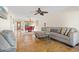 Open concept living room and dining room with beautiful tile floors, comfortable seating and natural light at 3289 Fairhaven Ln # 112, Sarasota, FL 34239