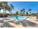 Community pool surrounded by lush landscaping, perfect for relaxation and recreation at 3289 Fairhaven Ln # 112, Sarasota, FL 34239