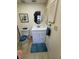 Bright bathroom with a glass-enclosed shower, decorative mirror, and a white vanity sink at 3500 El Conquistador Pkwy # 357, Bradenton, FL 34210