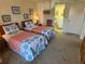 Comfortable bedroom with two twin beds, soft carpet, and ensuite bathroom at 3500 El Conquistador Pkwy # 357, Bradenton, FL 34210