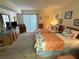 Bedroom featuring two twin beds, closet, dresser, and relaxing atmosphere at 3500 El Conquistador Pkwy # 357, Bradenton, FL 34210