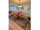 Charming dining room with round table, stylish rug, and decorative wall art at 3500 El Conquistador Pkwy # 357, Bradenton, FL 34210