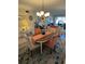 Cozy dining room featuring an oval table, stylish rug, and a bright chandelier at 3500 El Conquistador Pkwy # 357, Bradenton, FL 34210