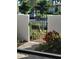 Elegant gate with a view of landscaped greenery, offering a glimpse of the property's serene atmosphere at 3500 El Conquistador Pkwy # 357, Bradenton, FL 34210