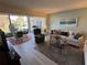 Bright living room with a water view, comfortable seating, and stylish decor at 3500 El Conquistador Pkwy # 357, Bradenton, FL 34210