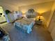 Bright main bedroom features a neutral color palette and a full bathroom at 3500 El Conquistador Pkwy # 357, Bradenton, FL 34210