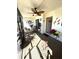 Enclosed patio with stylish ceiling fan, comfortable seating, and decorative plants for relaxation at 3500 El Conquistador Pkwy # 357, Bradenton, FL 34210