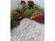 Charming patio area with brick pavers and colorful landscaping, perfect for outdoor relaxation at 3500 El Conquistador Pkwy # 357, Bradenton, FL 34210