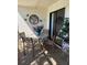 Cozy patio seating area with a decorative table, flowers, and views of lush greenery at 3500 El Conquistador Pkwy # 357, Bradenton, FL 34210