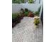 Charming patio area with brick pavers and colorful landscaping, perfect for outdoor relaxation at 3500 El Conquistador Pkwy # 357, Bradenton, FL 34210
