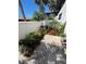 Charming patio with brick pavers surrounded by lush landscaping and beautiful flowers, perfect for outdoor relaxation at 3500 El Conquistador Pkwy # 357, Bradenton, FL 34210
