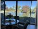 A view of a scenic pond seen from the enclosed back porch at 3500 El Conquistador Pkwy # 357, Bradenton, FL 34210